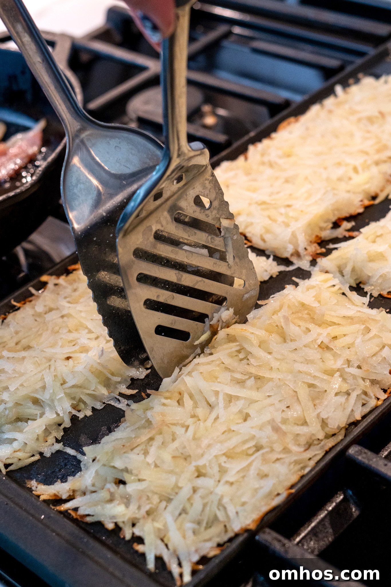 Homemade Crispy Hash Browns Recipe 9 Separating hash browns with spatulas