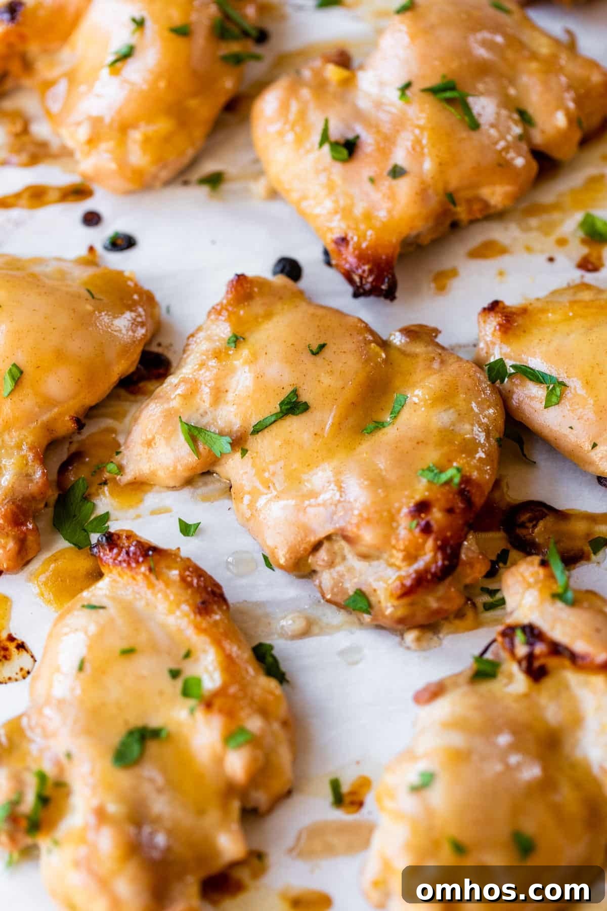marinated chicken thighs on parchment paper