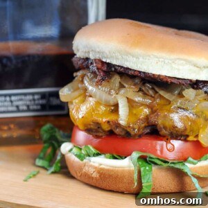 Whiskey burger next to bottle of whiskey.