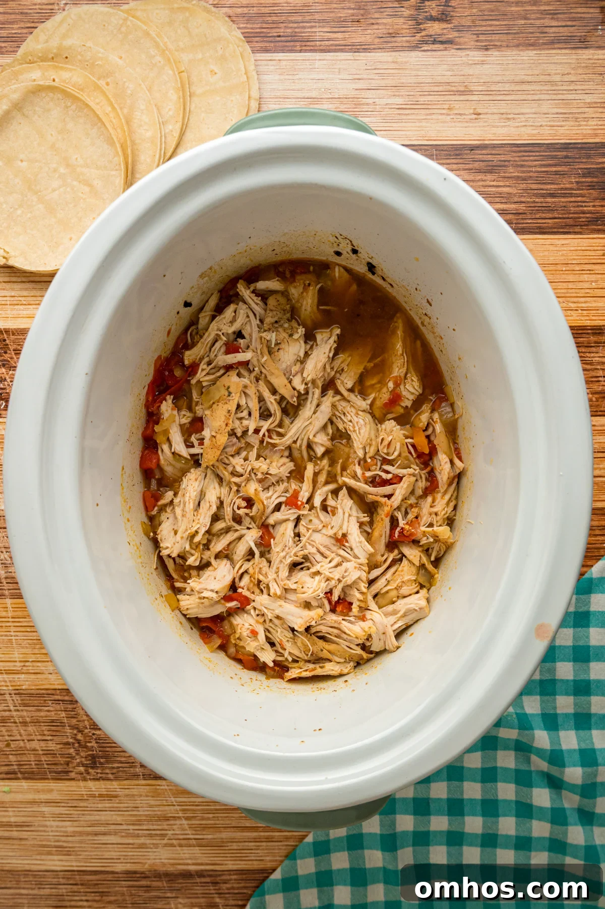 Classic King Ranch Chicken Casserole Recipe 4 Shredded chicken in a crockpot.