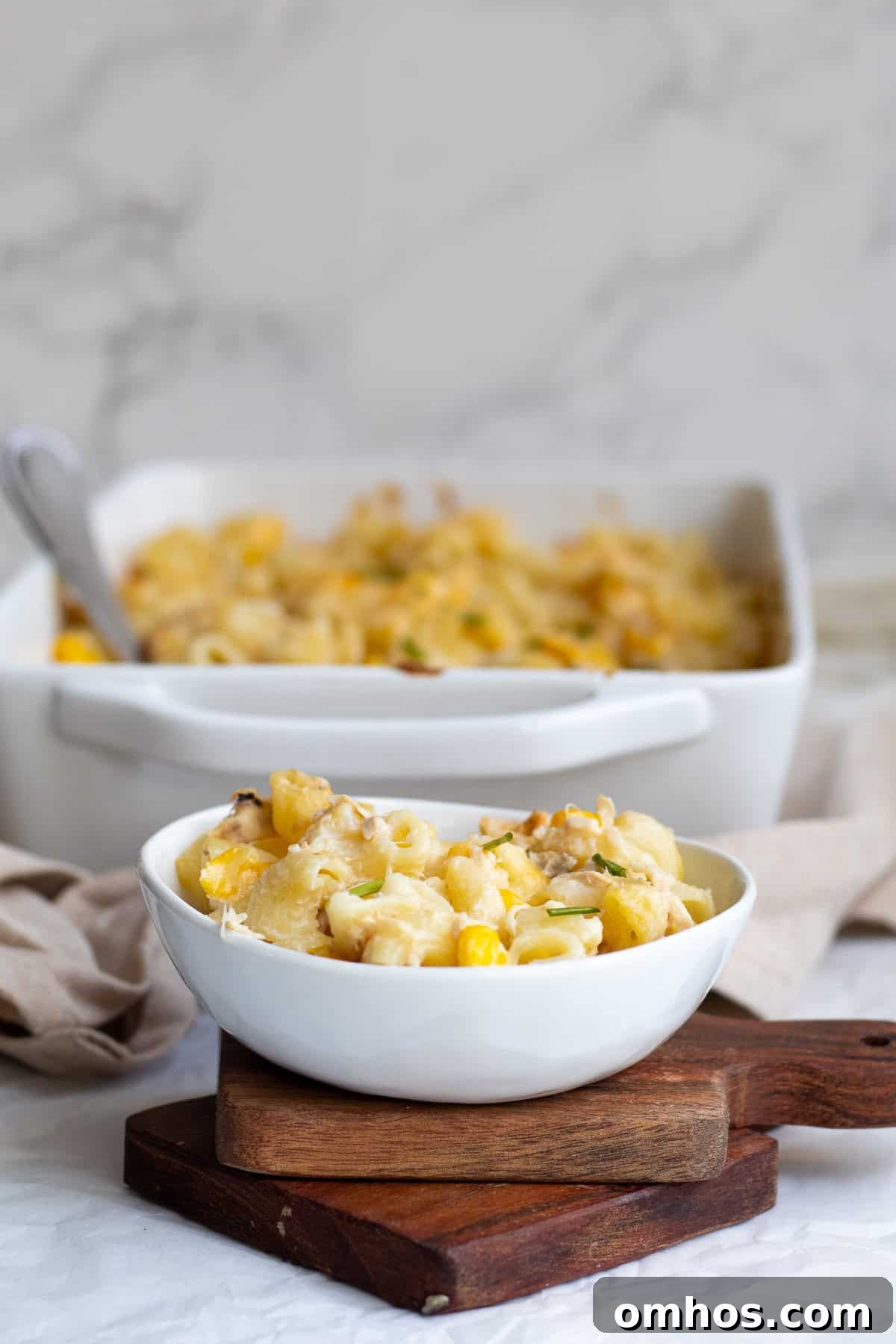 Creamy 30 Minute Tuna and Sweetcorn Pasta Bake Recipe 2 bowl of sweetcorn tuna pasta in front of casserole dish