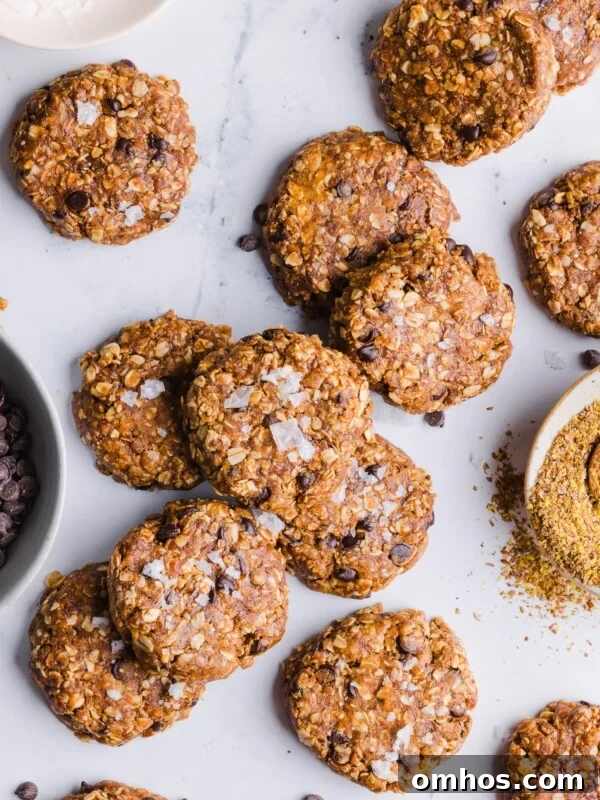 No bake protein cookies scattered on a countertop.
