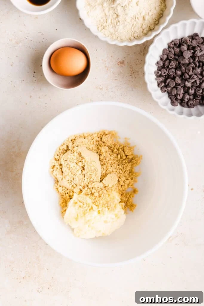 Chewy Whole Wheat Chocolate Chip Cookies Recipe 4 Brown sugar and butter in a white bowl.