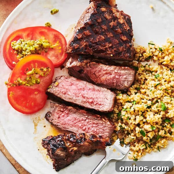 How to Achieve Perfect Crosshatch Grill Marks on Steak 5 Grains, tomatoes, and Grilled Marinated NY Strip Steak on a plate.