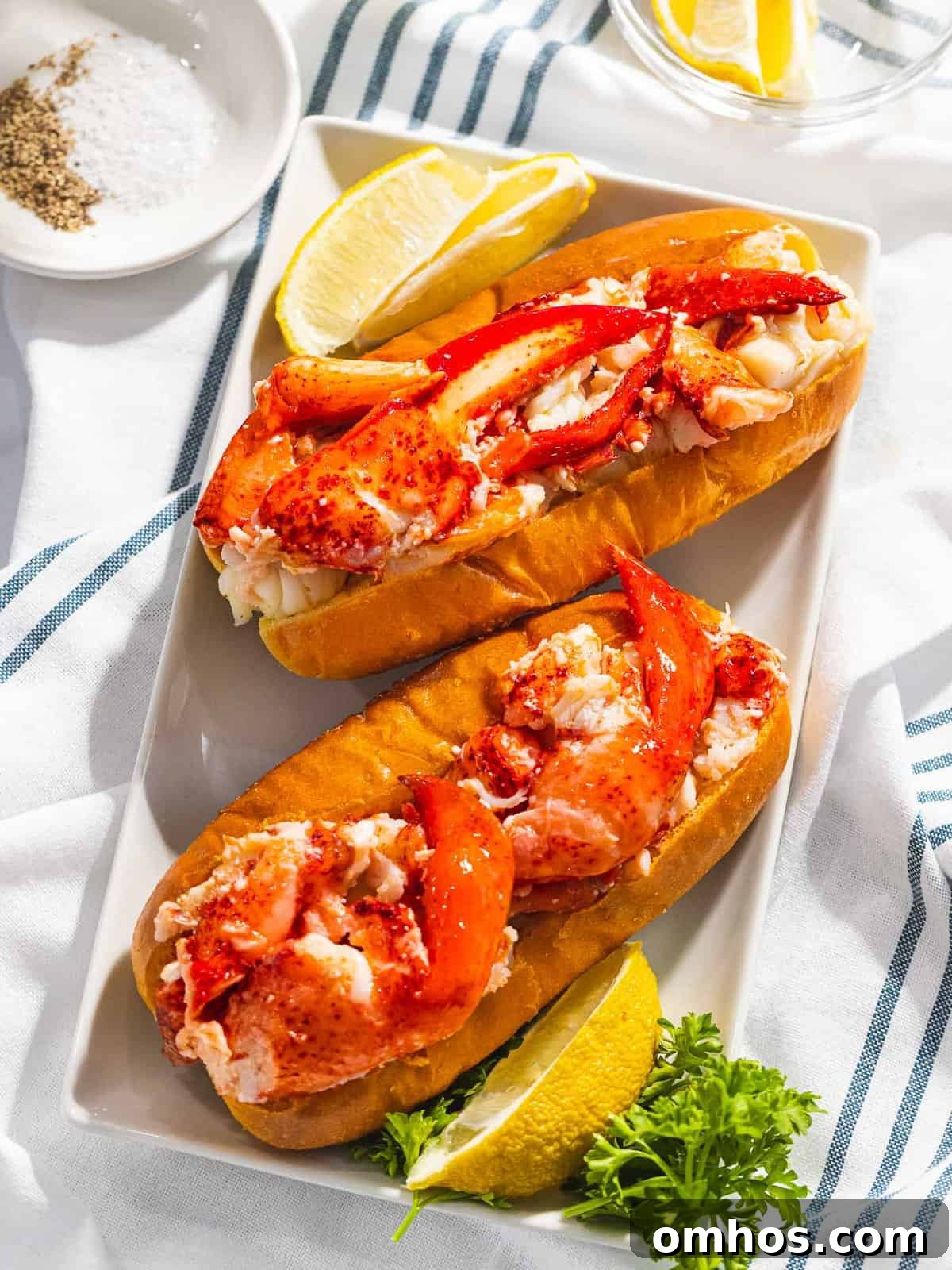 Warm Connecticut-Style Lobster Roll Recipe 2 Connecticut-style warm lobster rolls with lobster claw meat.