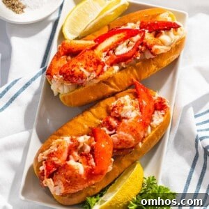 Warm Connecticut-Style Lobster Roll Recipe 8 Connecticut lobster rolls or warm lobster rolls on a plate.