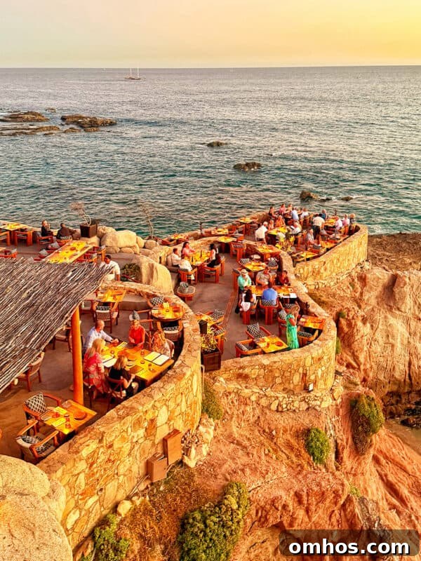 Cocina del Mar seaside fine dining restaurant tables by the Sea of Cortez in Cabo San Lucas.