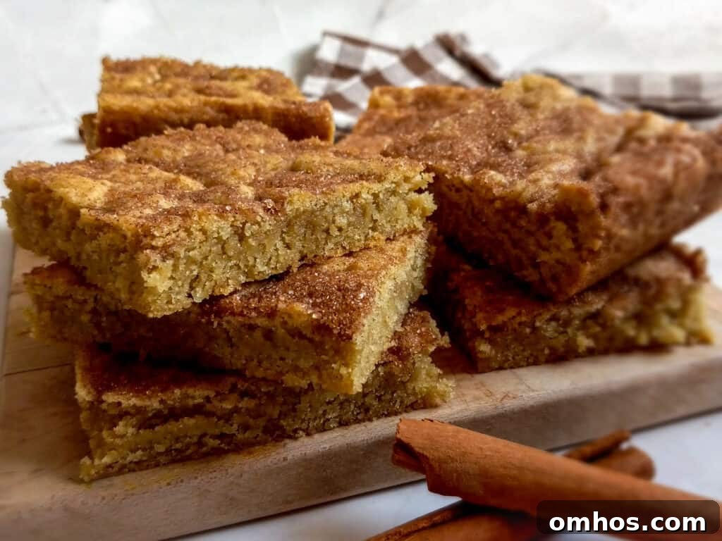 stack of snickerdoodle bars on a board.