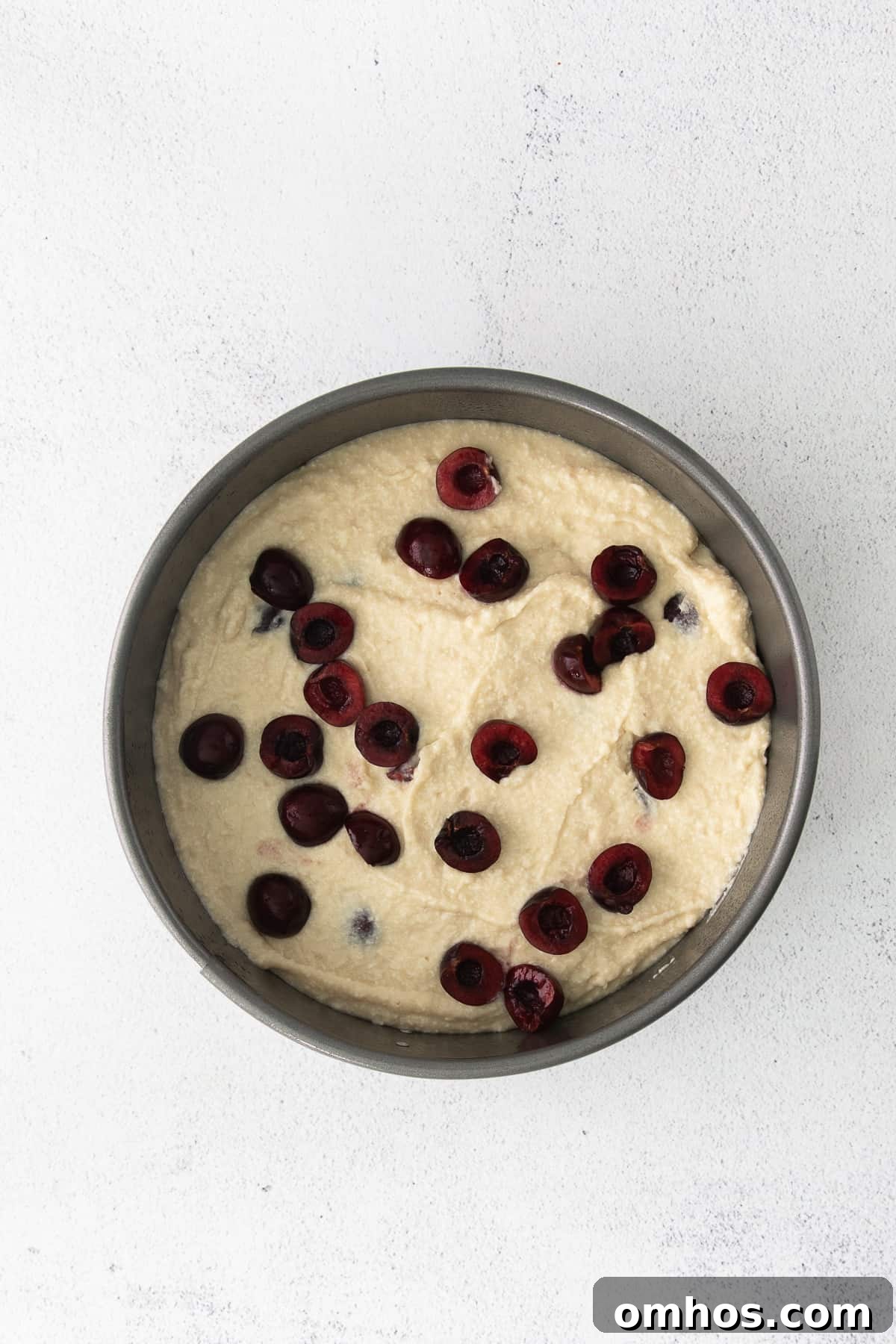 Ricotta cake in cake pan.