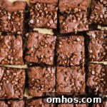 Tahini brownies with chocolate chips on parchment paper.