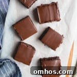 A layer of brownie, a layer of raspberry jam, and a layer of chocolate ganache make up these delicious Raspberry Truffle Brownies.