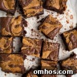 Peanut butter swirl brownies on parchment paper.