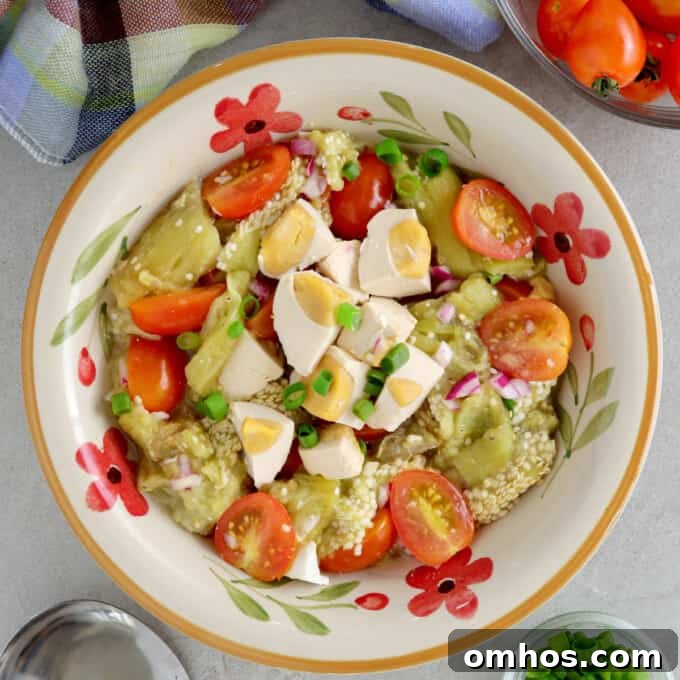 Tomato, Grilled Eggplant and Salted Egg Salad in a serving bowl