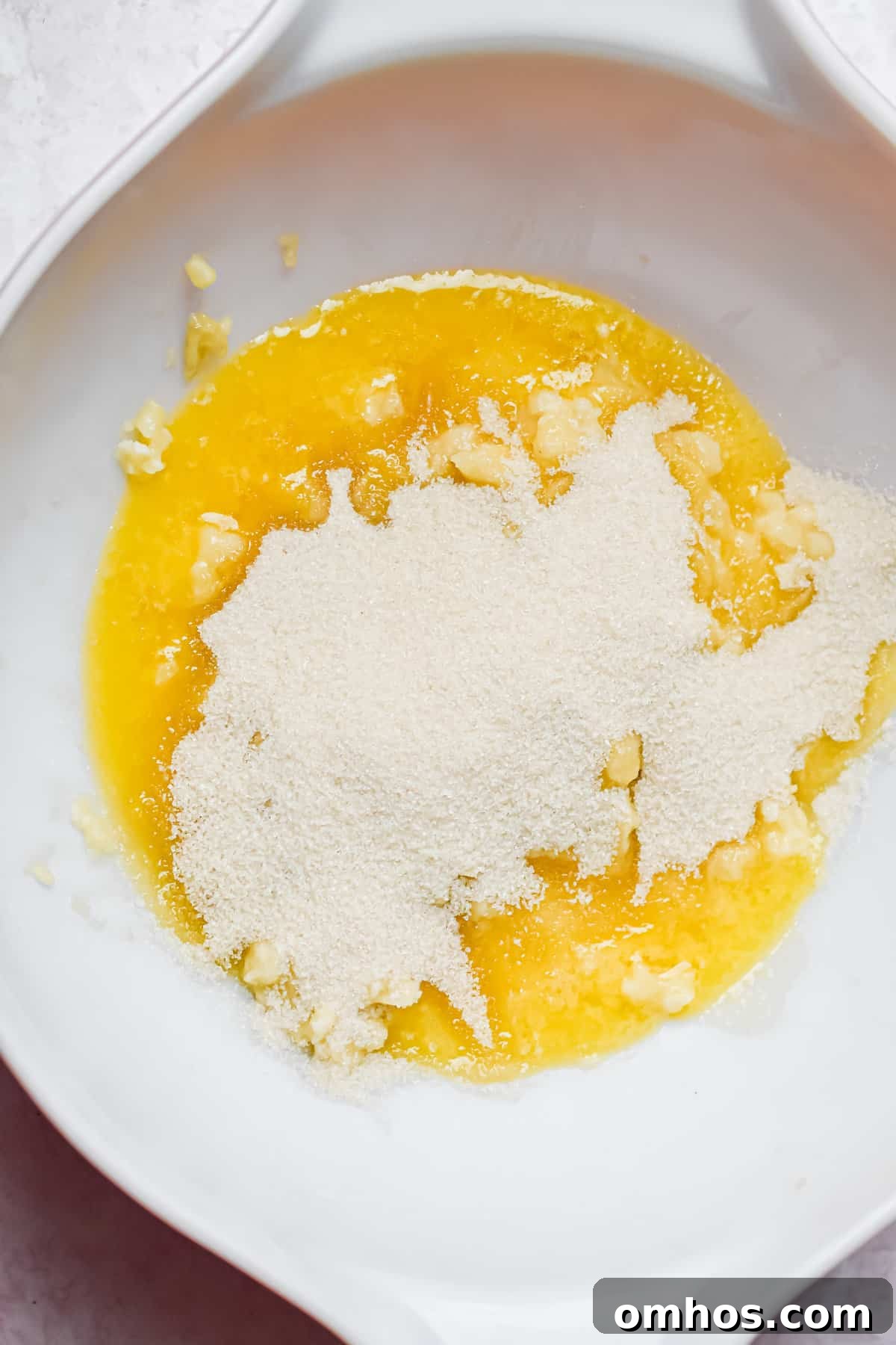 bananas, sugar, and butter are added to the bowl.