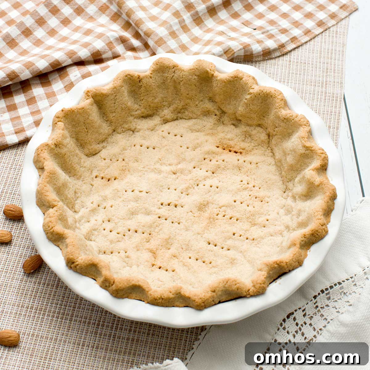 A gluten-free almond flour pie crust in a pie plate.