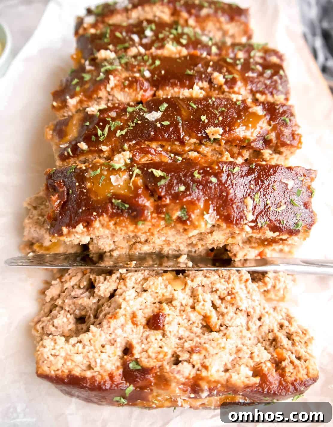 Flavorful Paleo Meatloaf Recipe: Dairy Free, Gluten Free 2 Slices of paleo meatloaf on a dish.