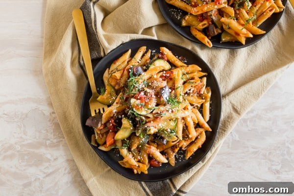 Ratatouille Pasta on a plate with a fork. 