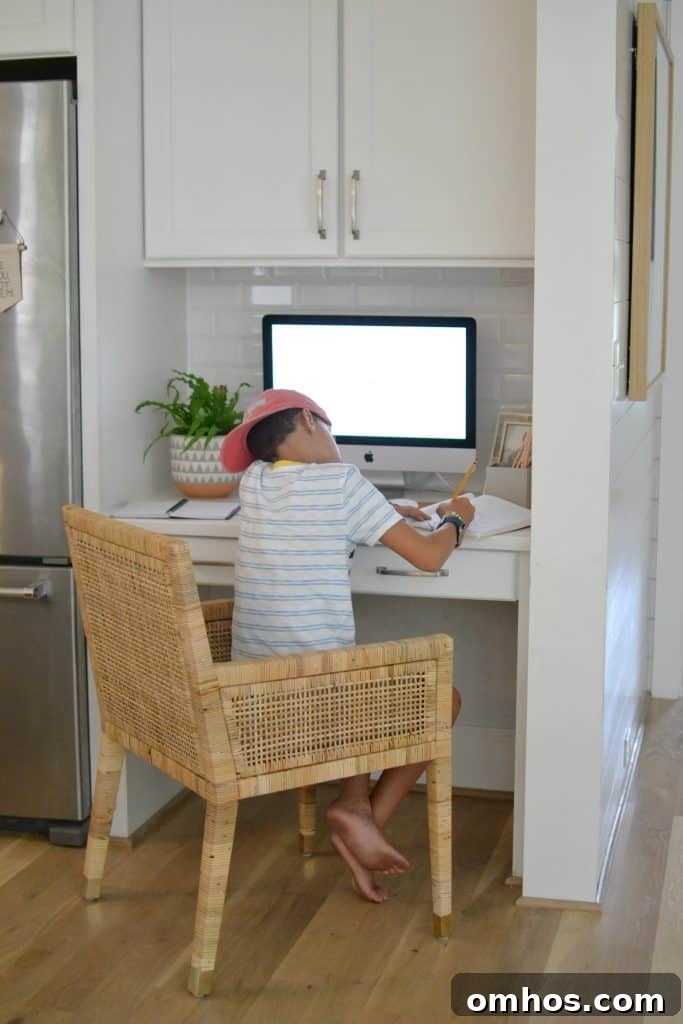 boy at kitchen desk working 