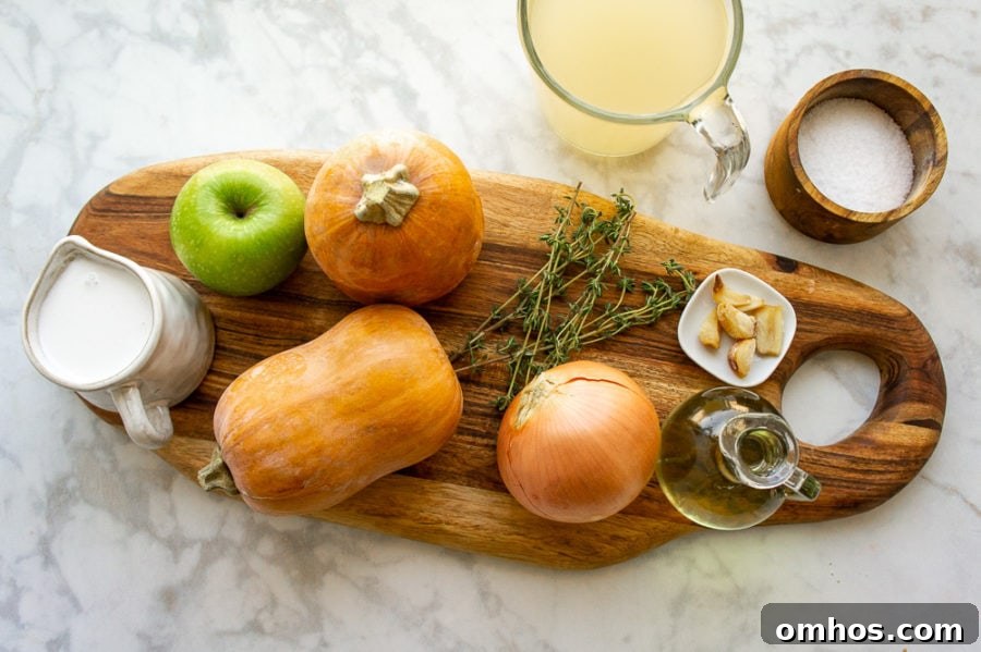 Roasted Honeynut Squash Soup Recipe 3 ingredients for making honeynut squash soup on a wooden cutting board