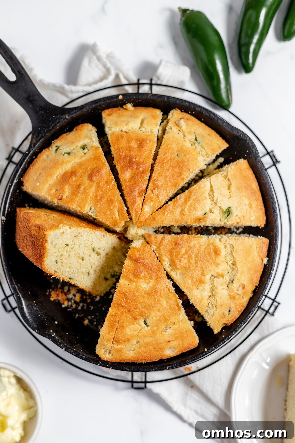 Slices of Jalapeno Cornbread in a cast iron skillet.