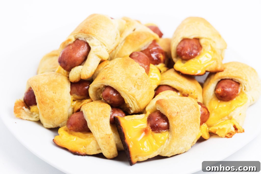 Cheesy Pigs in a Blanket Recipe: Cheese-Stuffed Sausage Bites 2 cheesy pigs in a blanket