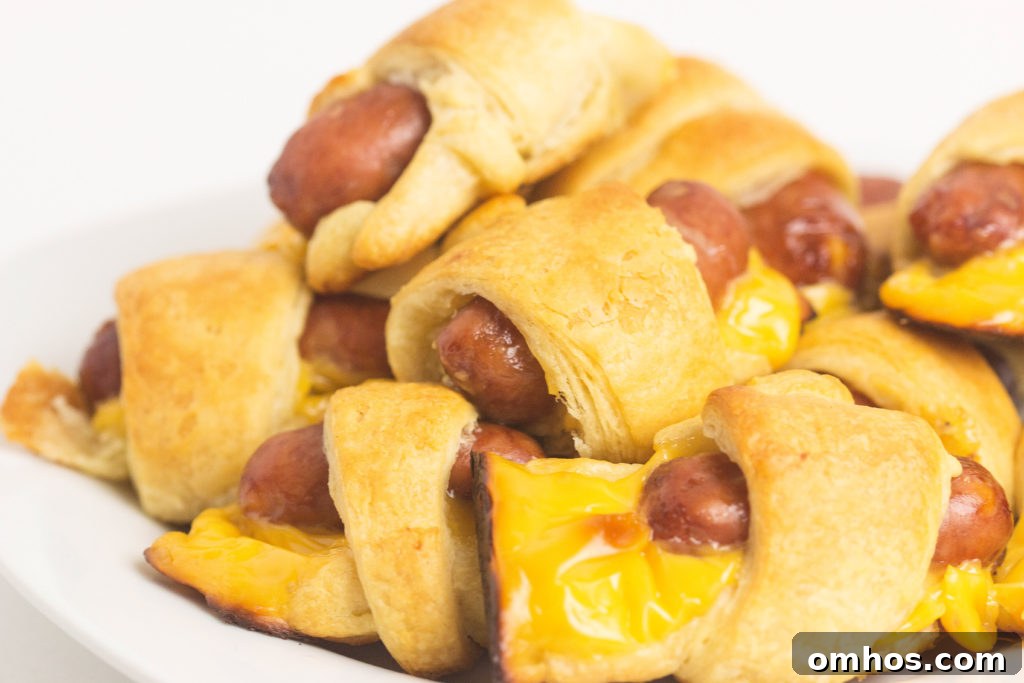 Cheesy Pigs in a Blanket Recipe: Cheese-Stuffed Sausage Bites 3 cheesy pigs in a blanket