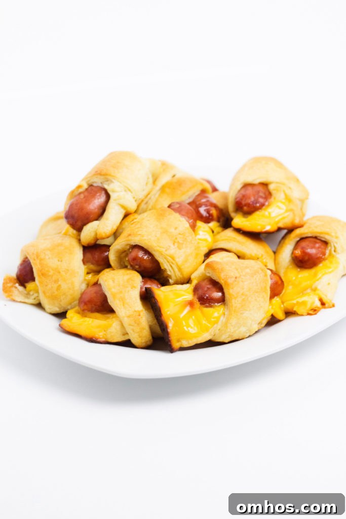 Cheesy Pigs in a Blanket Recipe: Cheese-Stuffed Sausage Bites 4 cheesy pigs in a blanket