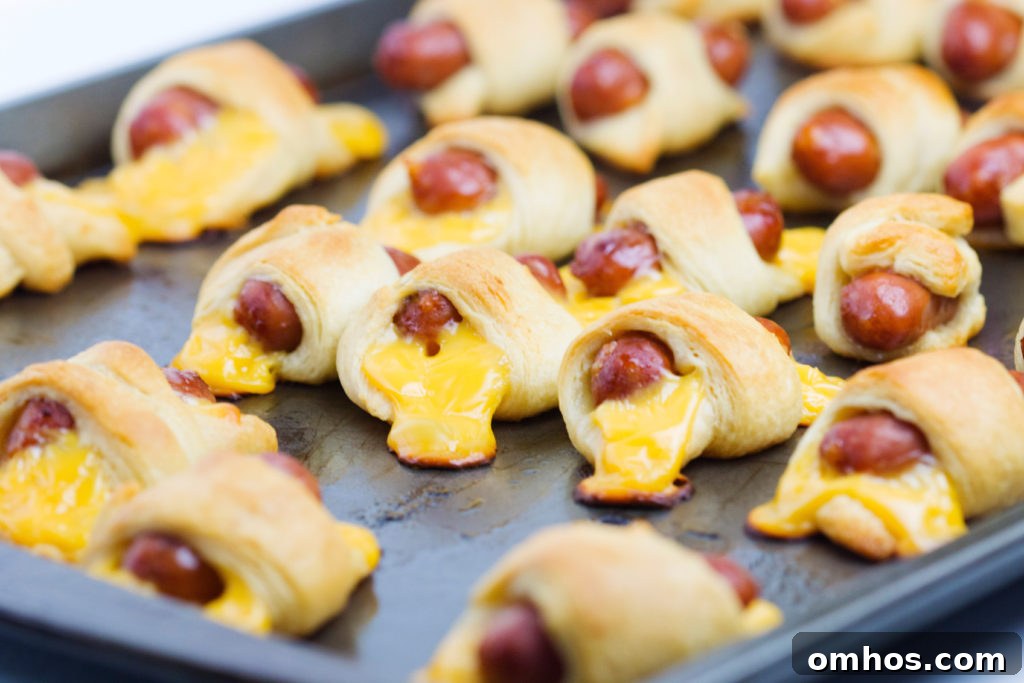 Cheesy Pigs in a Blanket Recipe: Cheese-Stuffed Sausage Bites 7 cheesy pigs in a blanket