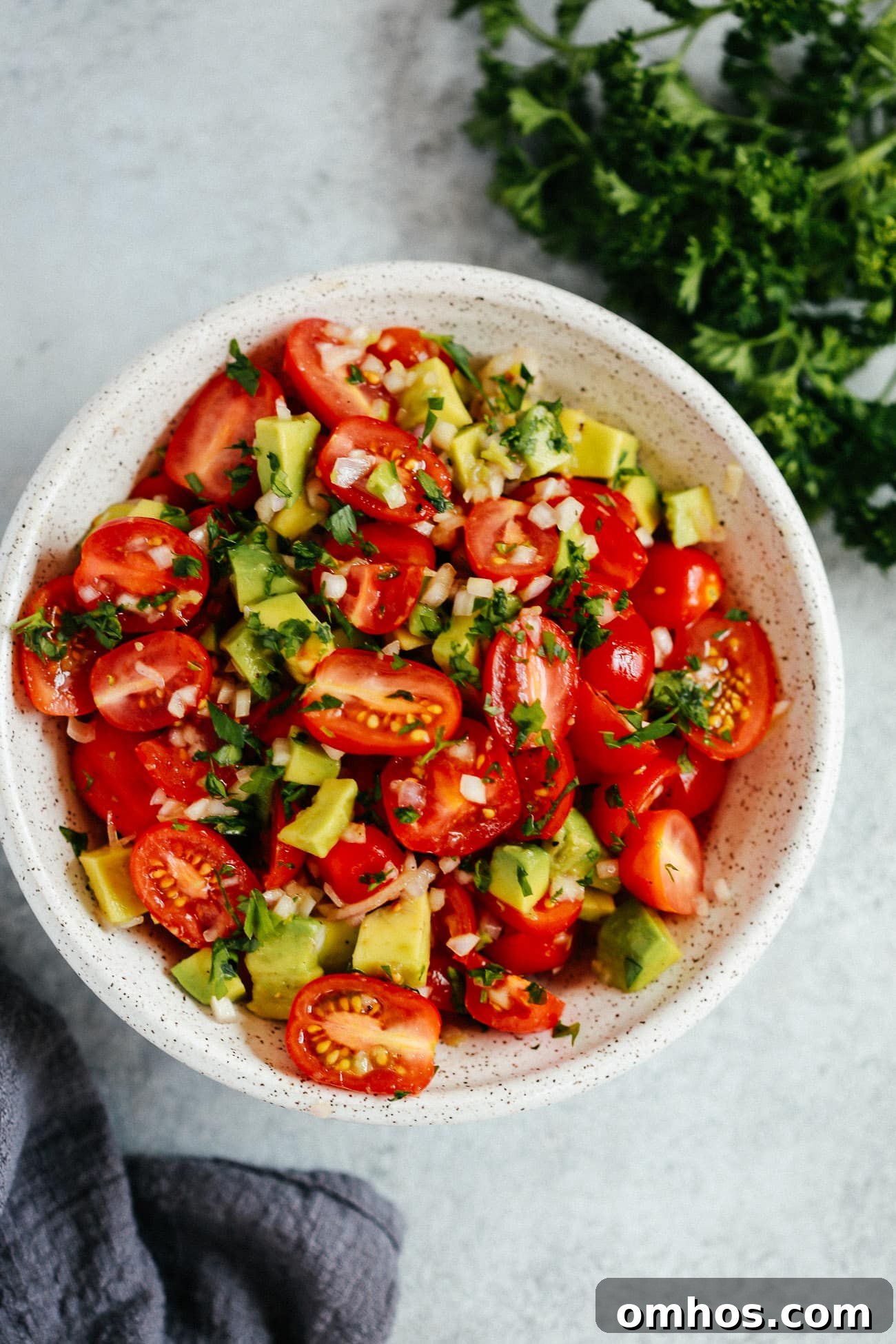 Bowl of avocado tomato salad.