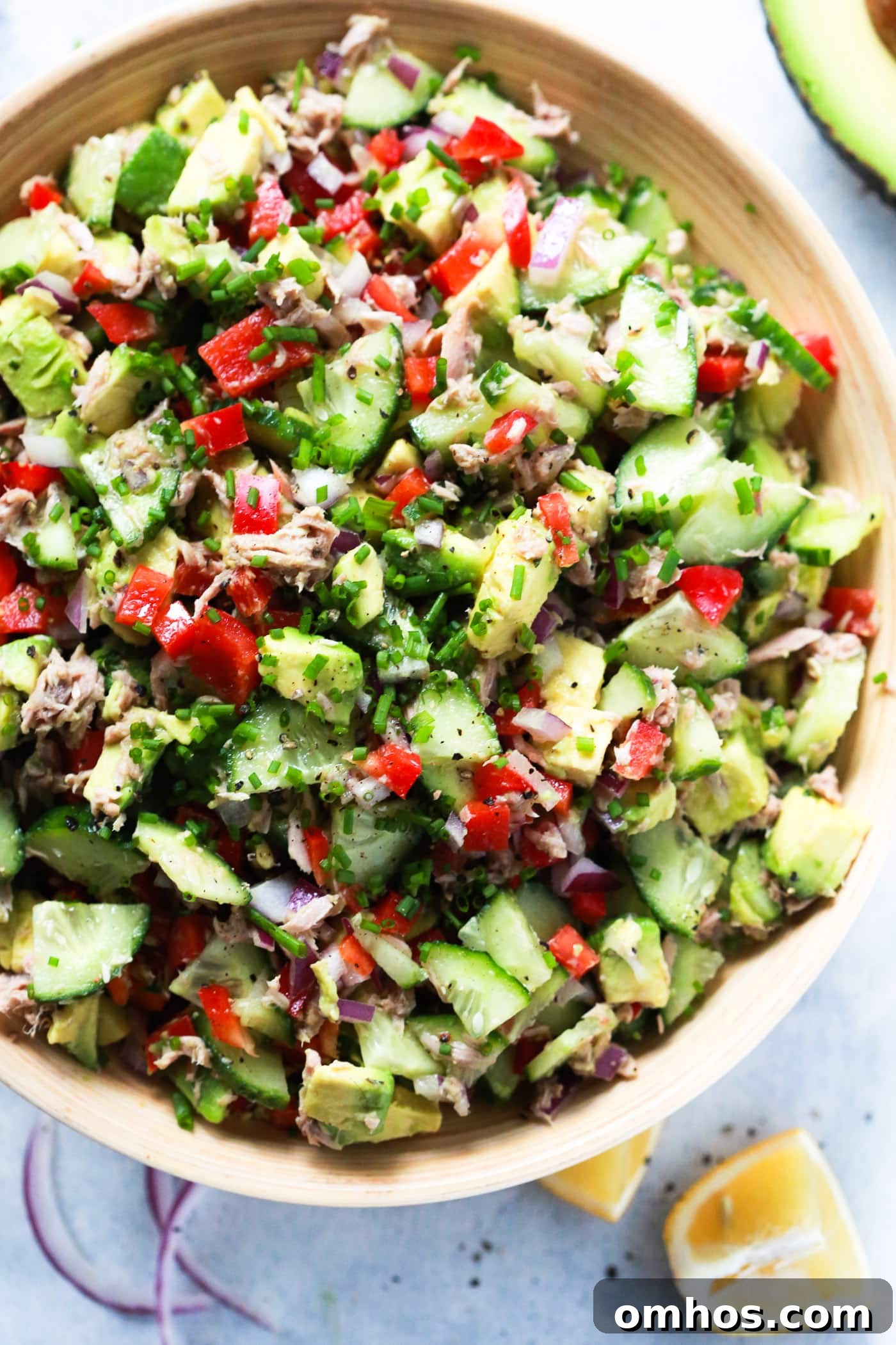 overhead view of a bowl of avocado cucumber salad 