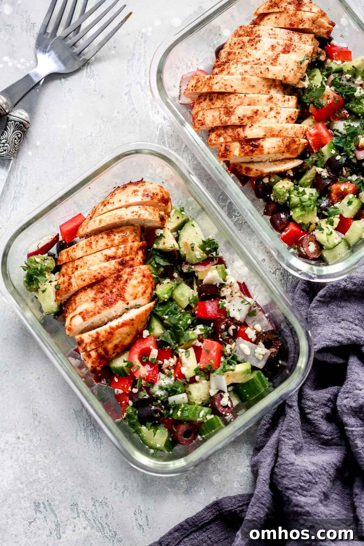 Greek Chicken Salad Bowls inside of two meal prep containers.