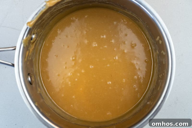 Adding the peanut butter to the pot