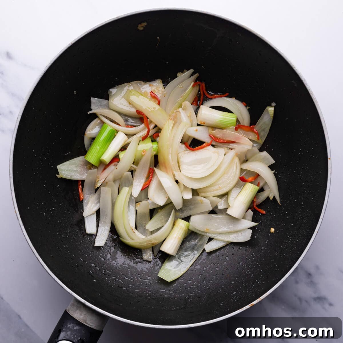 top down view of vegetables frying in the pan