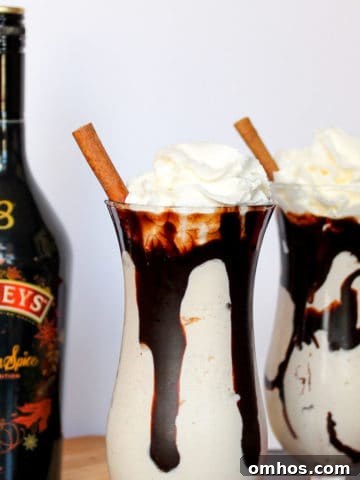 Baileys Pumpkin Spice Mudslide topped with whipped cream and a cinnamon stick.