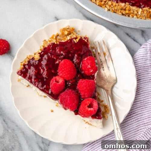 A slice of raspberry cream pie served on a small plate.