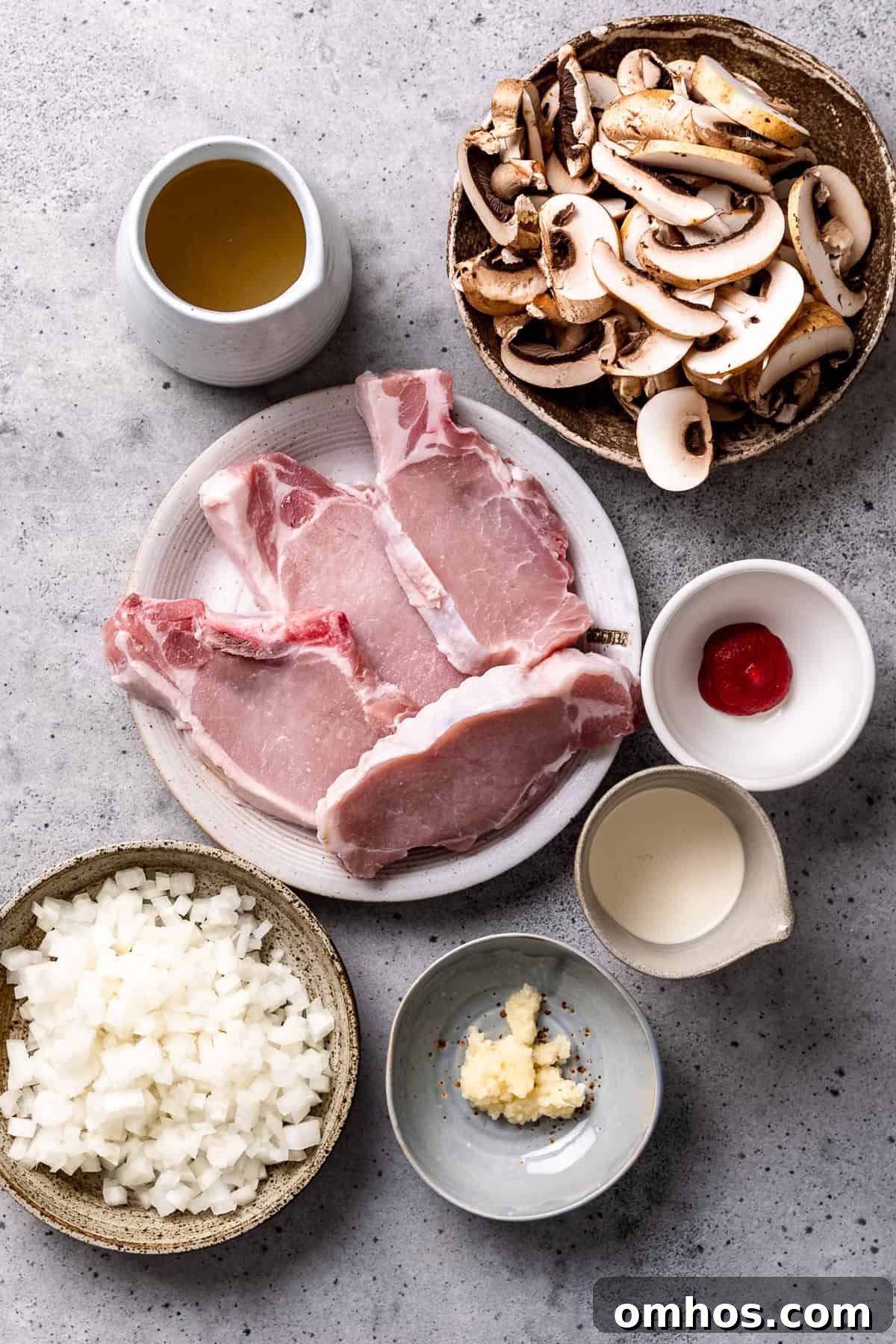 Ingredients for crock Pot pork chops with mushroom sauce on a table.