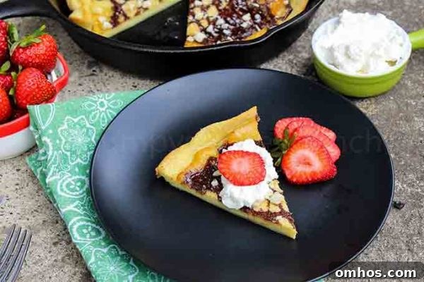 Low Carb skillet pancake slice on a black plate