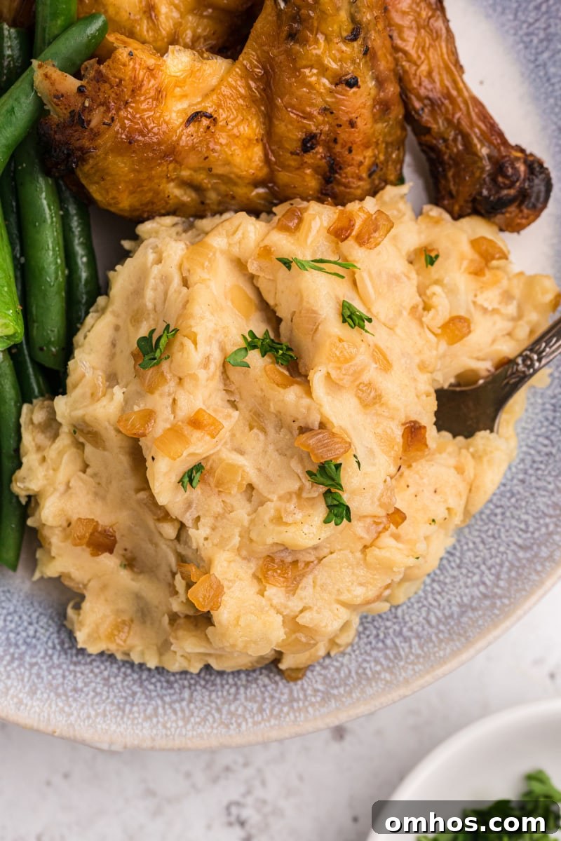 scoop of caramelized onion and horseradish mashed potatoes on a plate