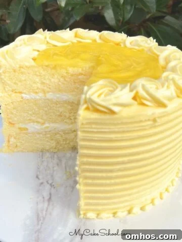 Moist Limoncello Bundt Cake with Lemon Glaze 6 Lemon Velvet Cake, sliced, on a cake pedestal.