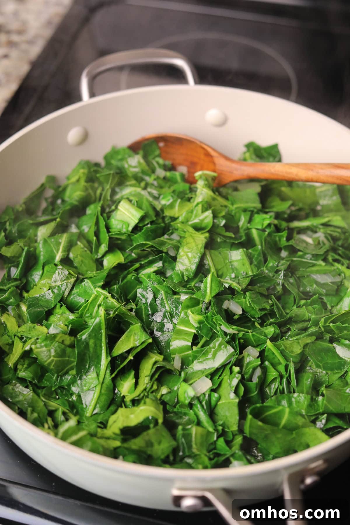 Vegan Southern Collard Greens Recipe 6 Collard greens cooking in a large skillet.