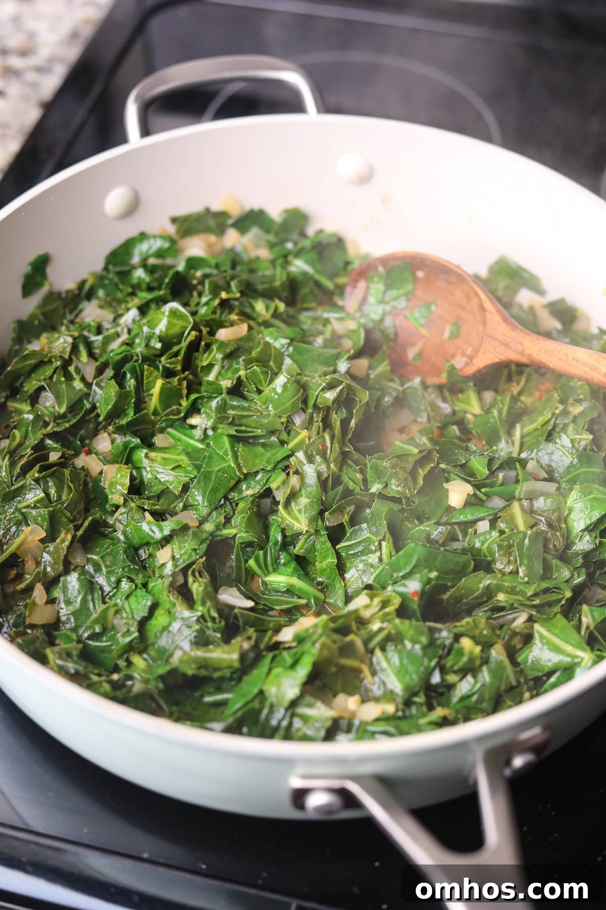 Vegan Southern Collard Greens Recipe 7 Collard greens cooking in a large skillet.