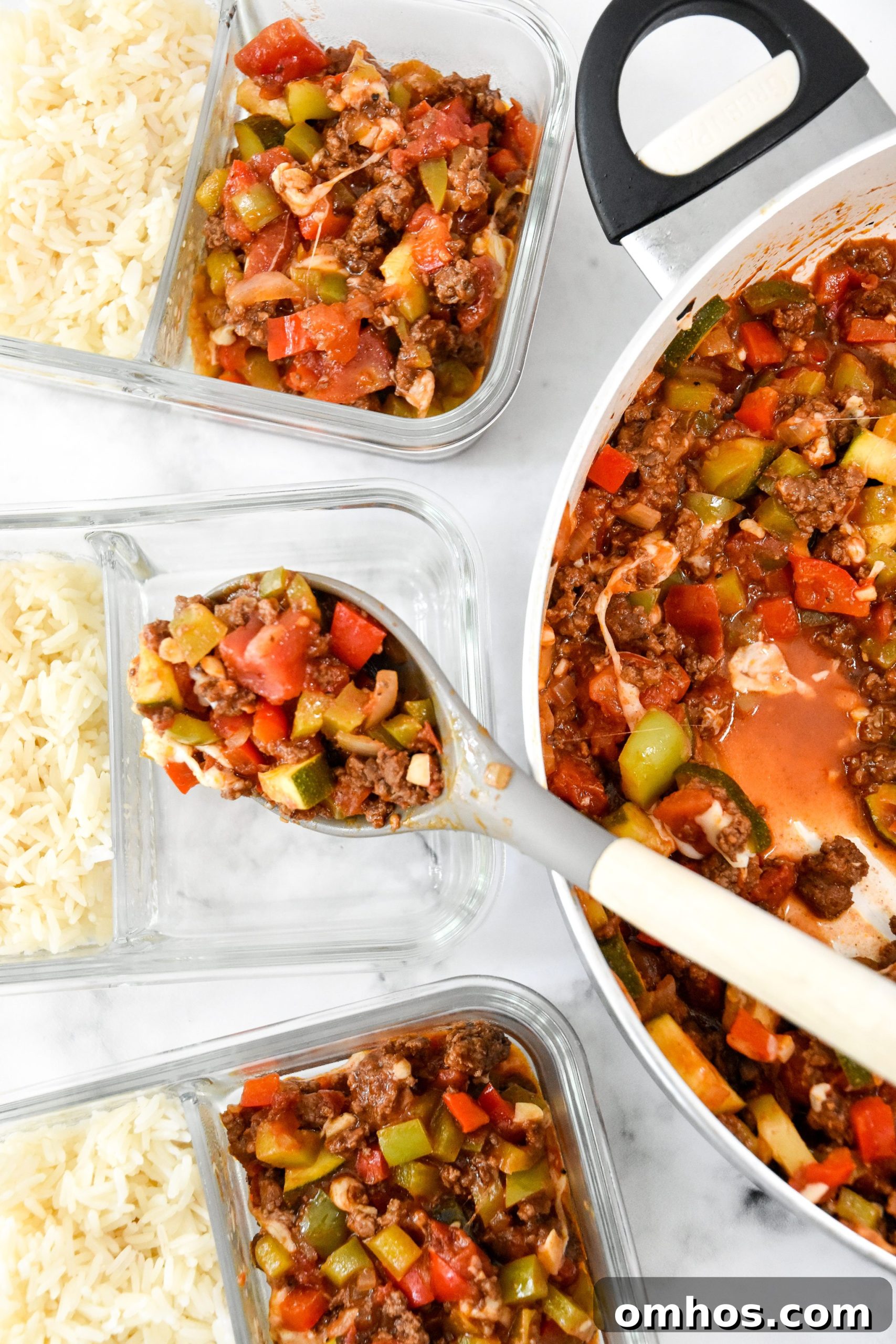 spooning unstuffed pepper mixture into the glass meal prep containers.