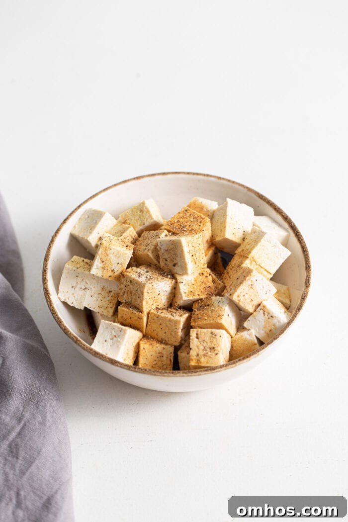 Cubed tofu with spices ready to bake.