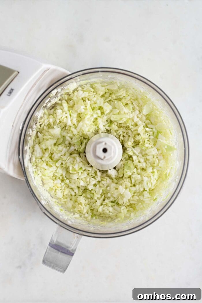 Cabbage pulsed into rice-like pieces in a food processor.