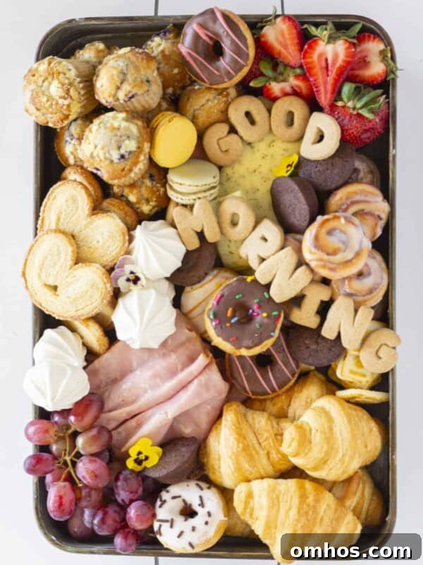 A charcuterie board full of breakfast items.