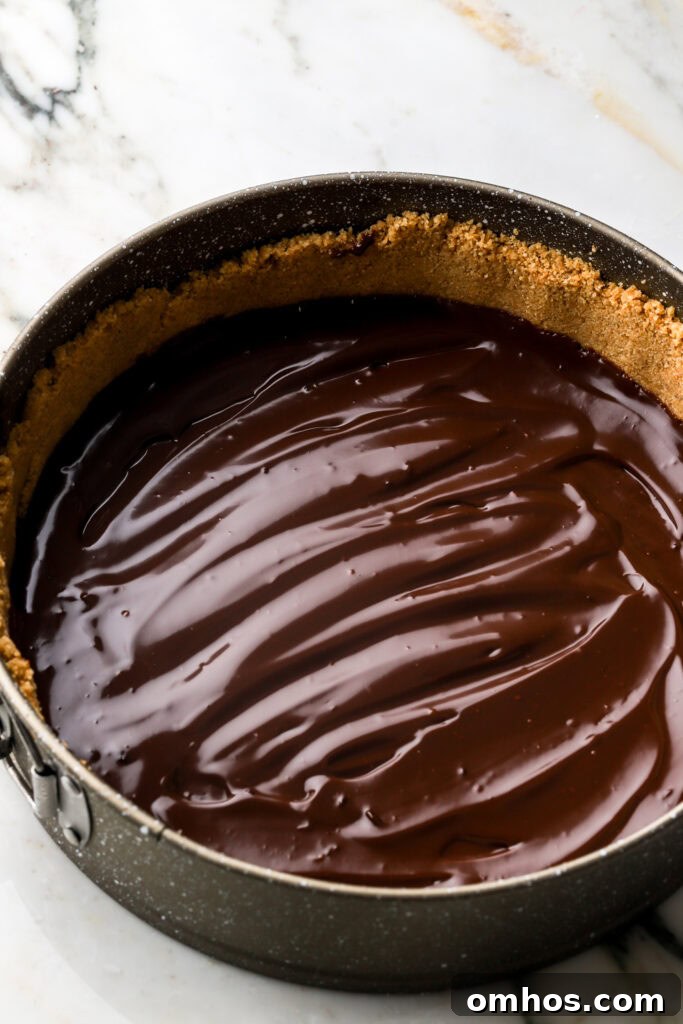 half of chocolate spread into pan