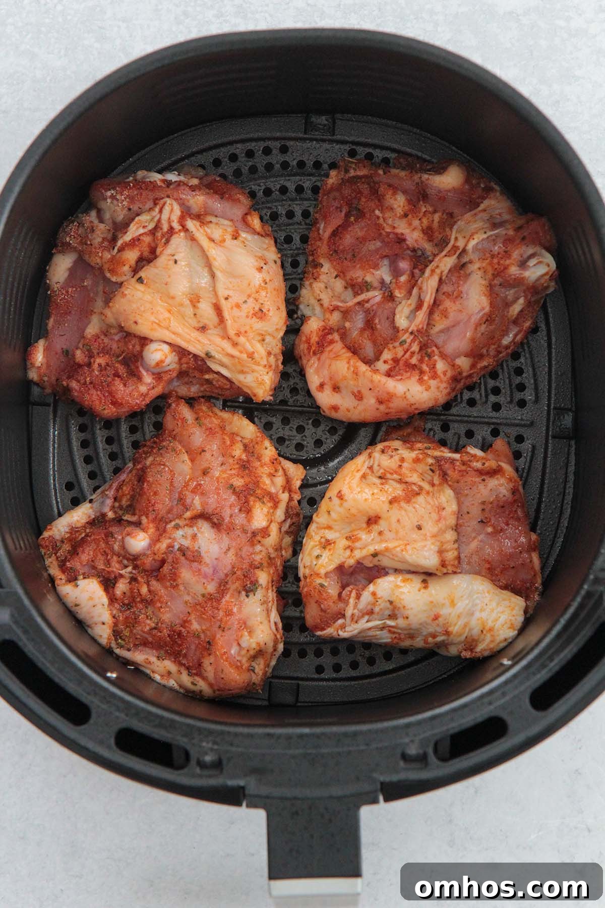 golden crispy air fryer chicken thighs on a plate