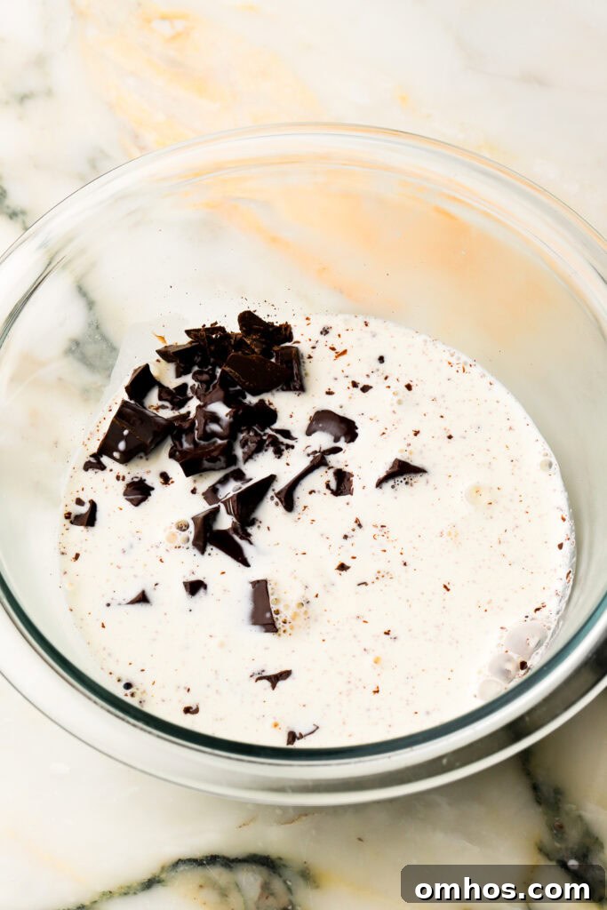 hot cream poured over chocolate for ganache