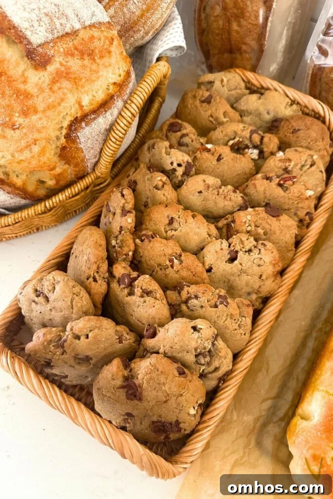 Spiced pecan sourdough cookies displayed on a rattan tray.