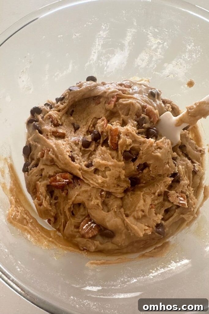 Spiced pecan sourdough cookie dough in a bowl.